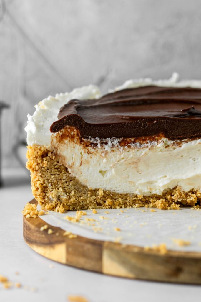 Chocolate ganache topped vanilla cheesecake with a buttery graham cracker crust.