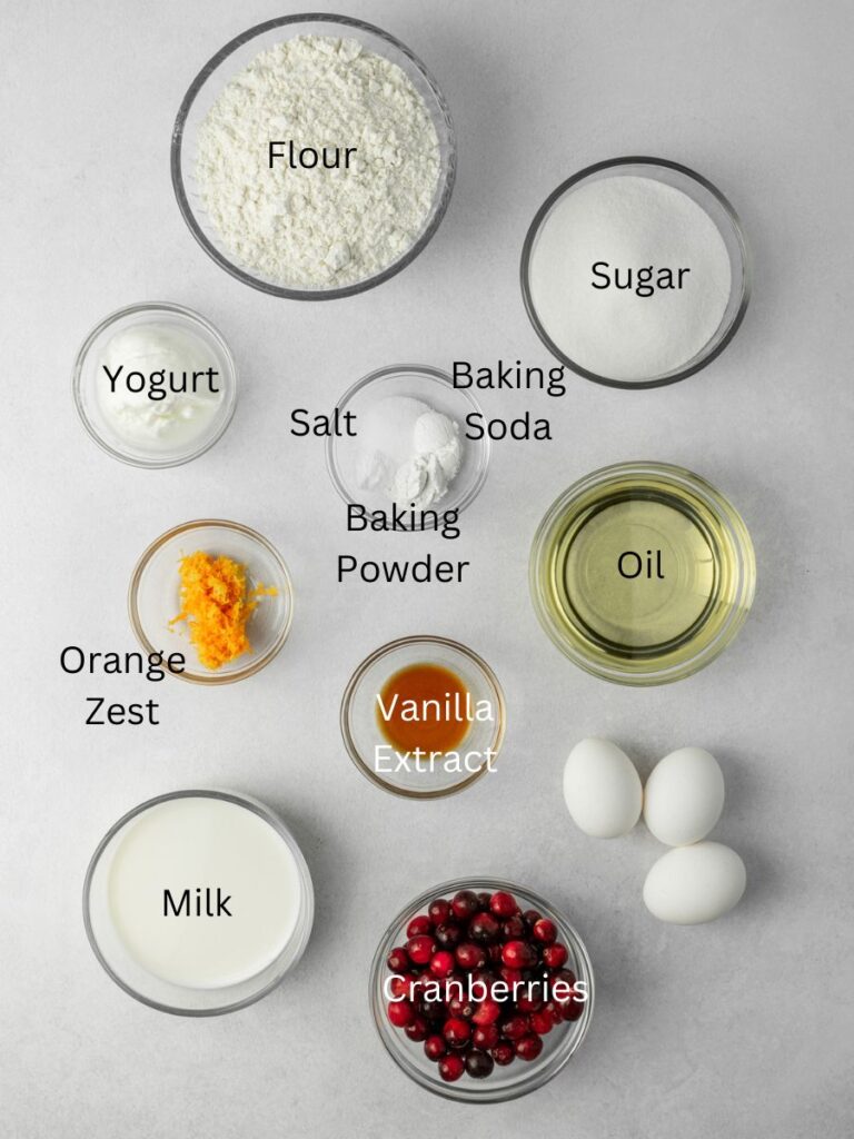 Ingredients needed: flour, sugar, yogurt, baking soda, baking powder, salt, oil, orange zest, vanilla, oil, milk, cranberries, and eggs.