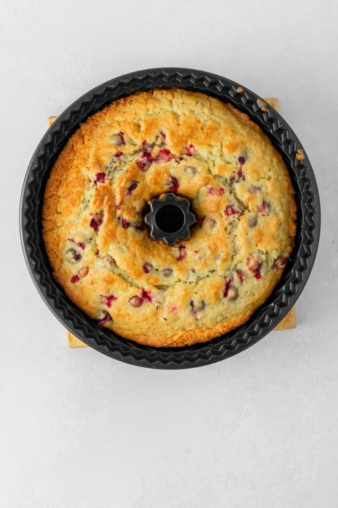 A baked cake in a bundt pan.