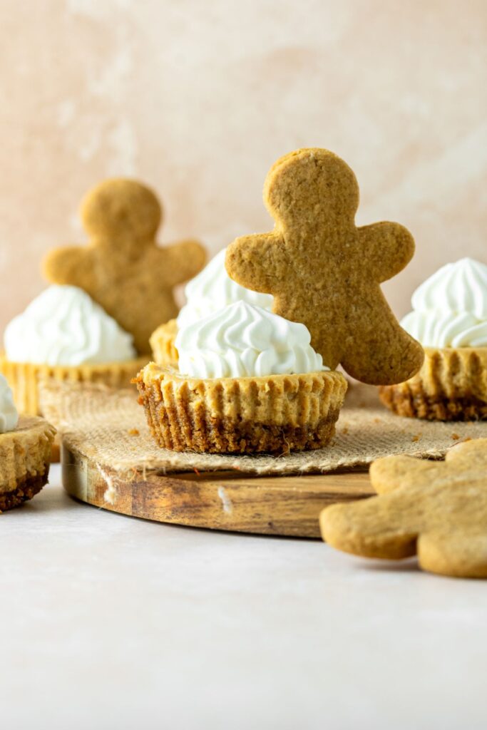 Gingerbread cheesecake bites topped with gingerbread men cookies.