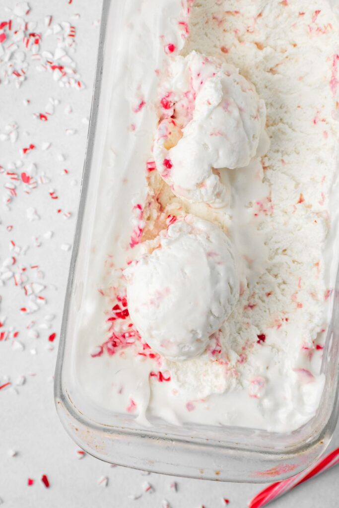 Two scoops of peppermint ice cream in a loaf pan.