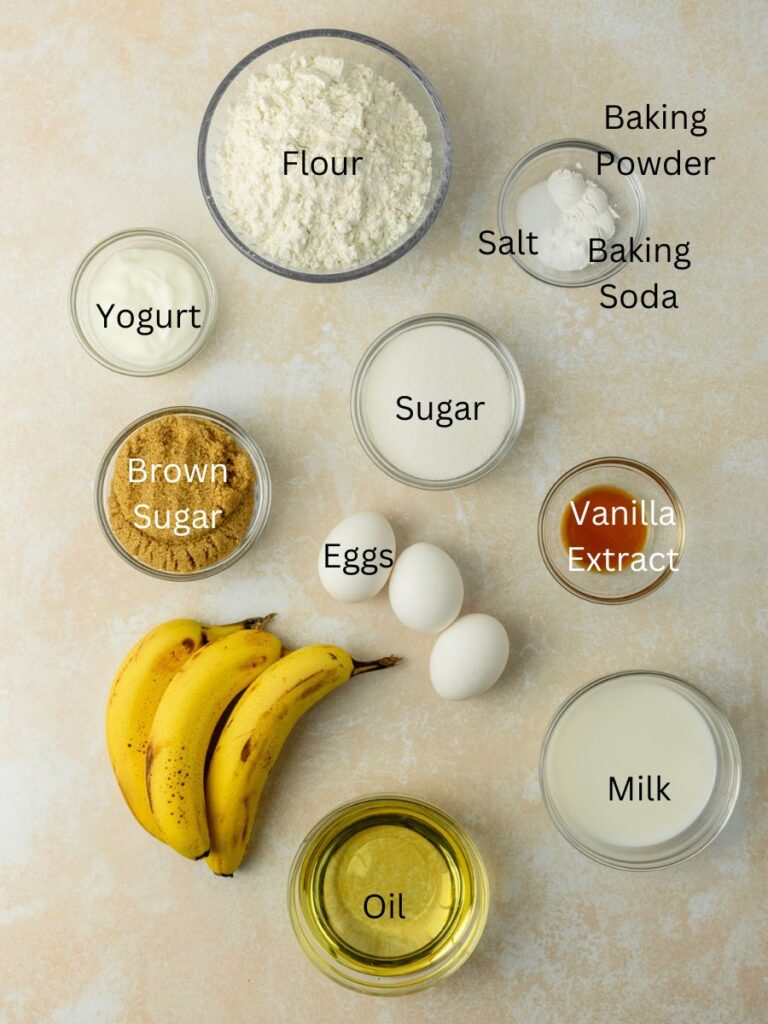 Ingredients needed: flour, salt, baking powder, baking soda, yogurt, sugar, brown sugar, vanilla, eggs, bananas, oil, and milk.