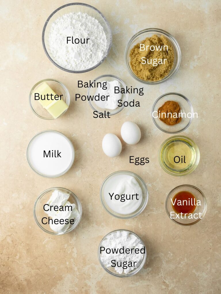 Ingredients needed: flour, brown sugar, butter, baking powder, baking soda, salt, cinnamon, eggs, milk, oil, cream cheese, yogurt, vanilla, and powdered sugar.