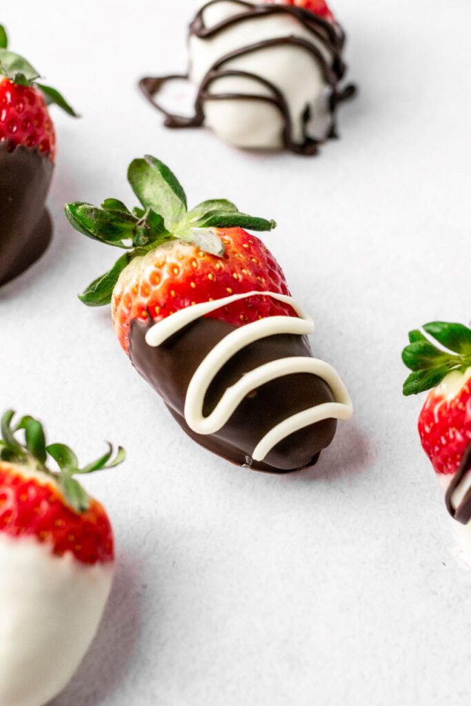 Chocolate covered strawberry with white chocolate drizzle.