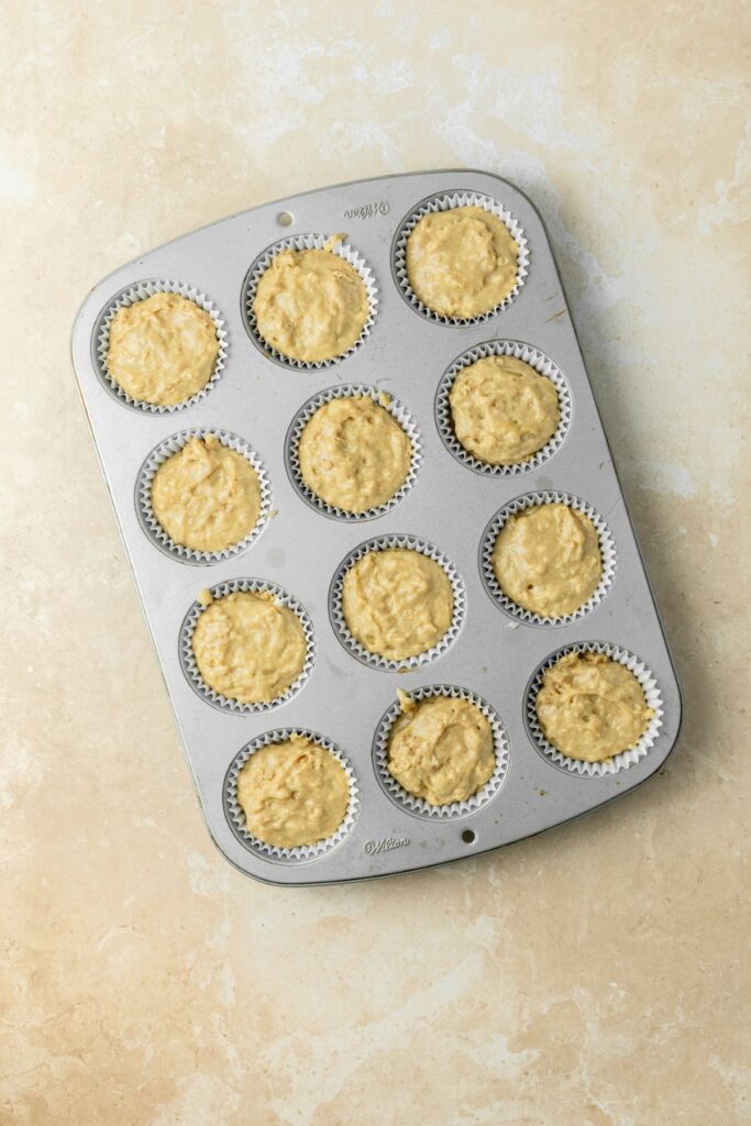 Muffins ready to bake in a muffin pan.