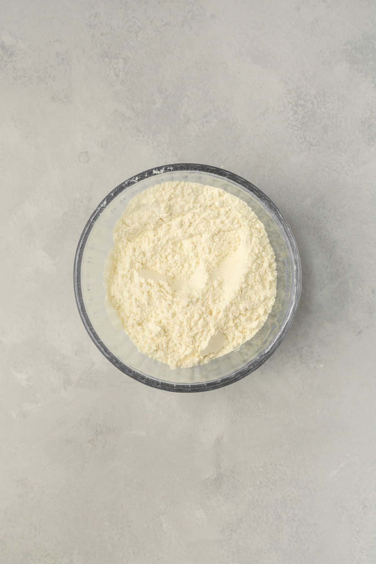 Dry ingredients for cupcakes mixed together in a small bowl.