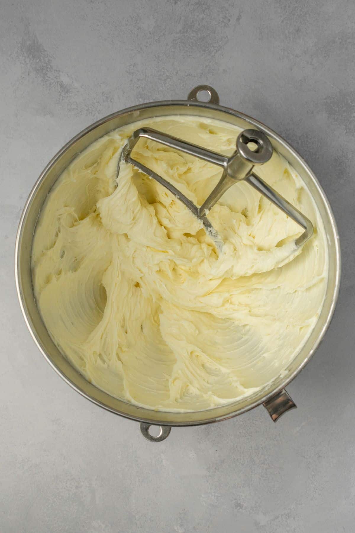 Lemon cream cheese frosting in a large bowl.