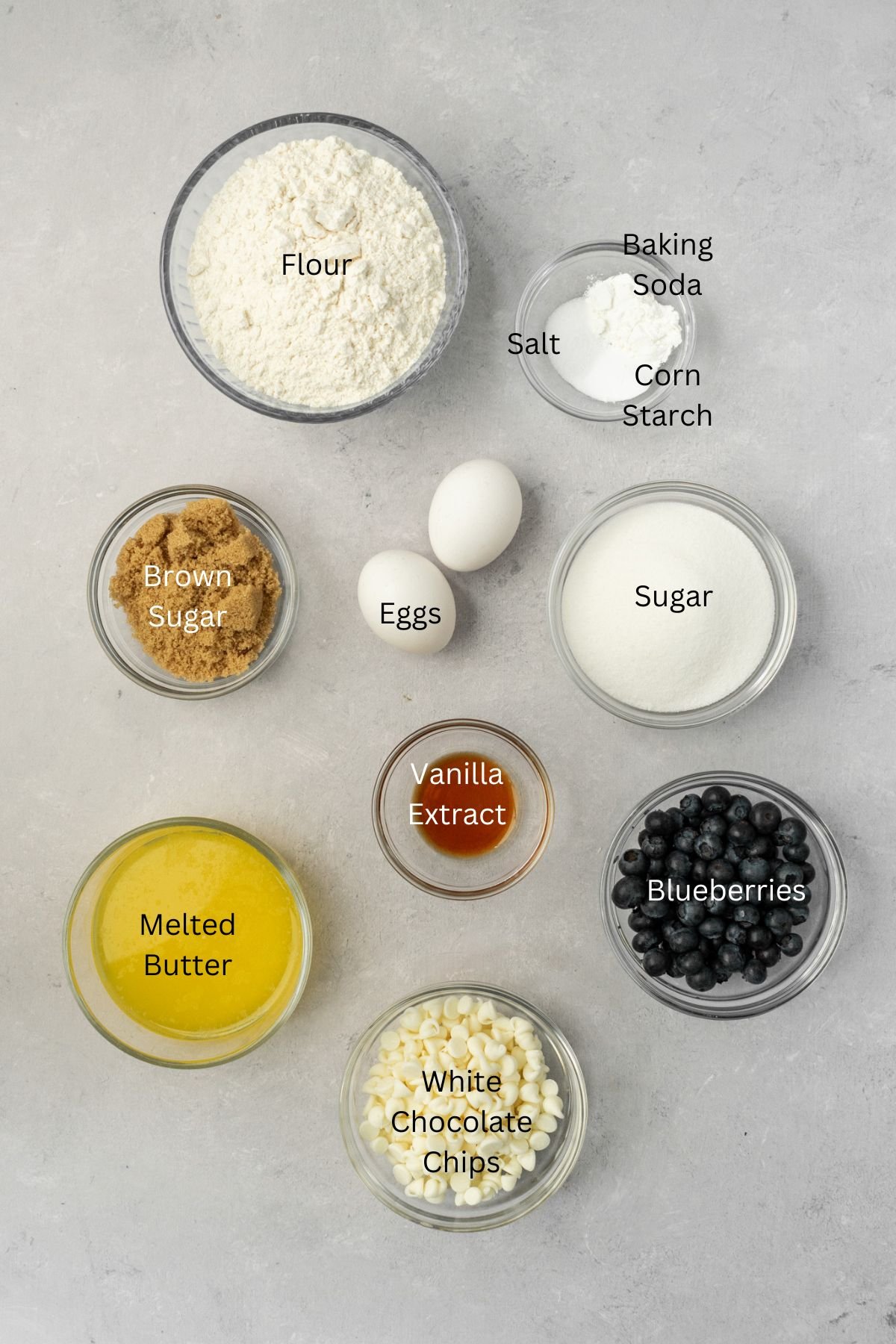 Ingredients: flour, baking soda, corn starch, salt, sugars, eggs, vanilla, butter, blueberries, and white chocolate.