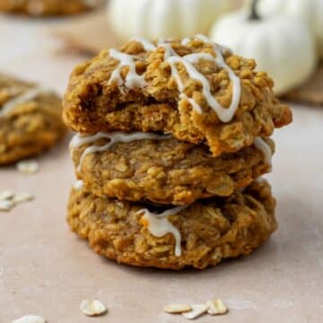 The best pumpkin oatmeal cookies that are stacked three high.