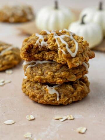 The best pumpkin oatmeal cookies that are stacked three high.