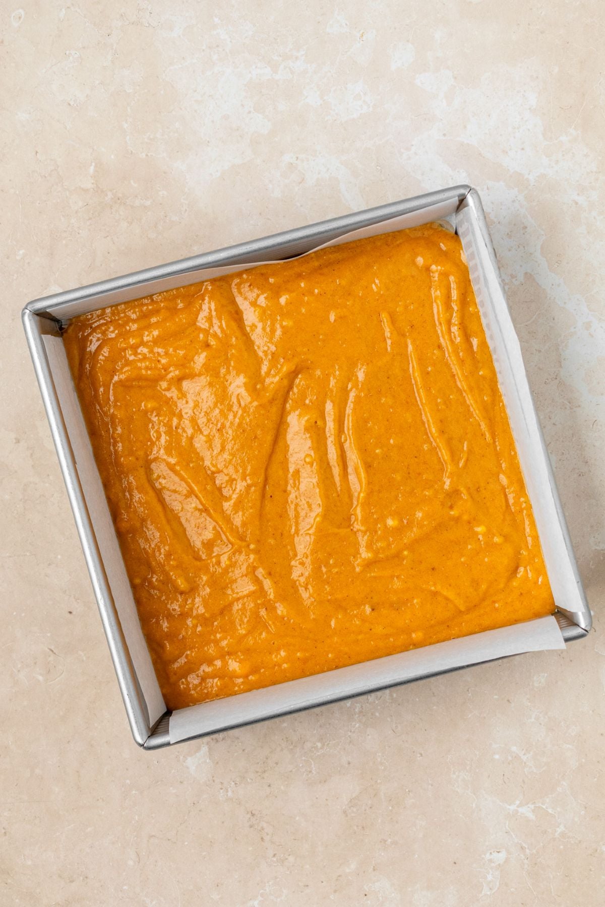 Pumpkin spice batter in a baking pan.