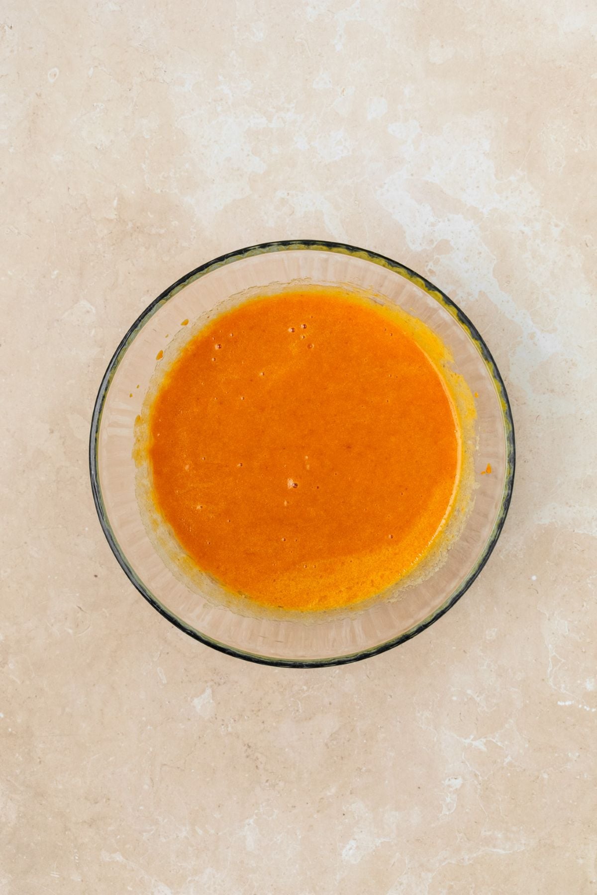 Pumpkin puree mixed together with eggs, sugar, vanilla, and oil.