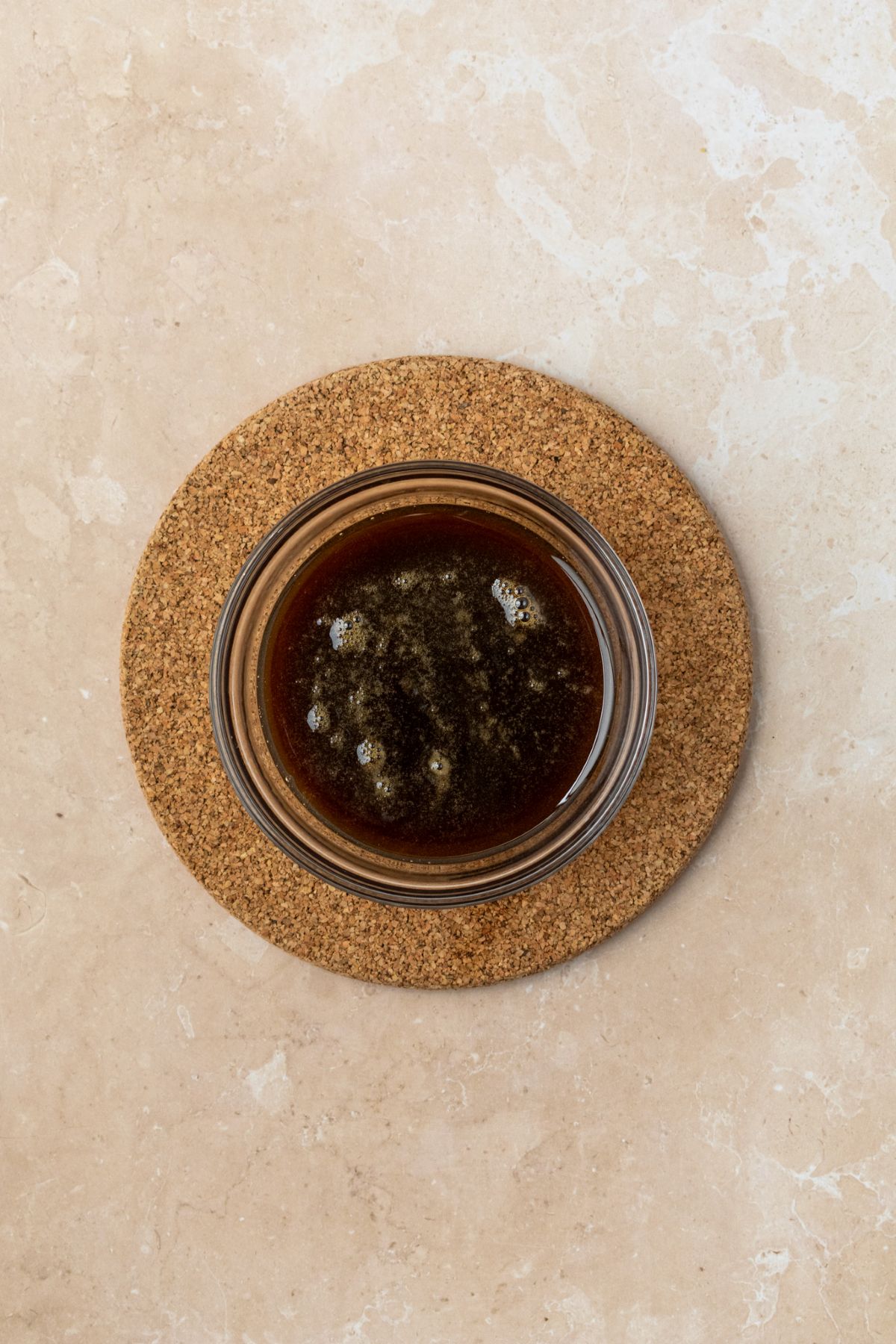 Brown sugar syrup in a glass bowl.