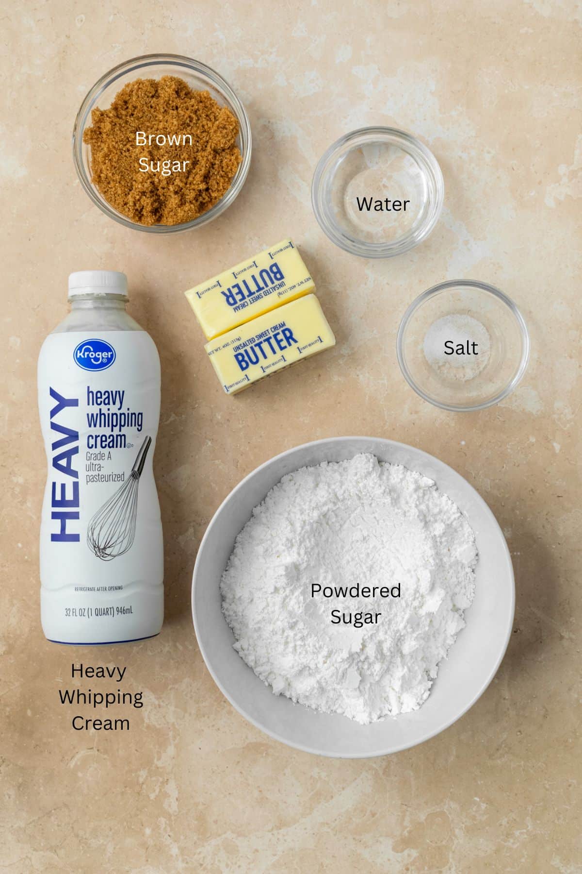 Ingredients for brown sugar frosting: brown sugar, water, salt, butter, heavy cream, and powdered sugar.