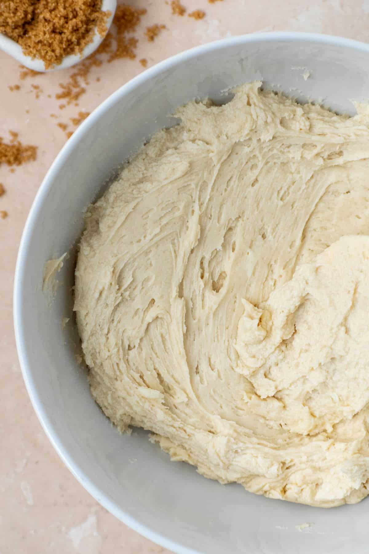 The best brown sugar frosting in a white bowl with a small bowl on the side.