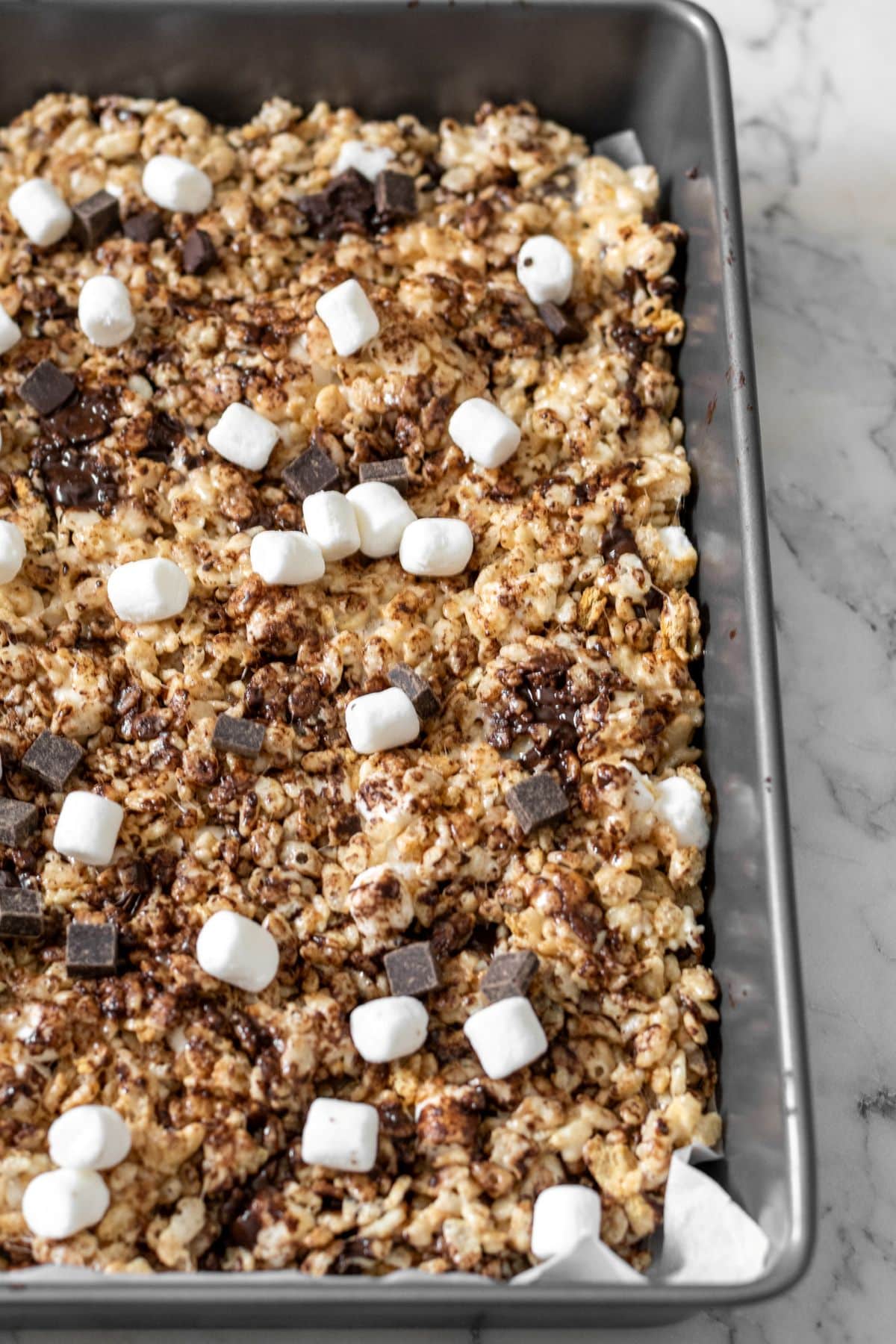 Smore's rice krisipie treats in a 9x13 inch baking pan.