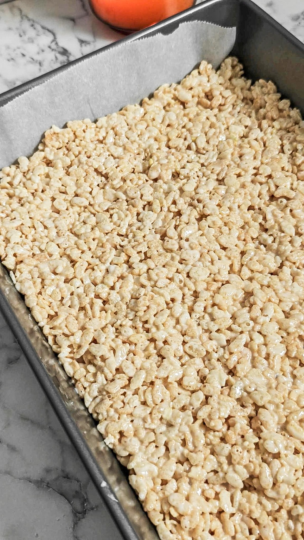 Maple rice krispie treats in a 9x13 inch baking pan.