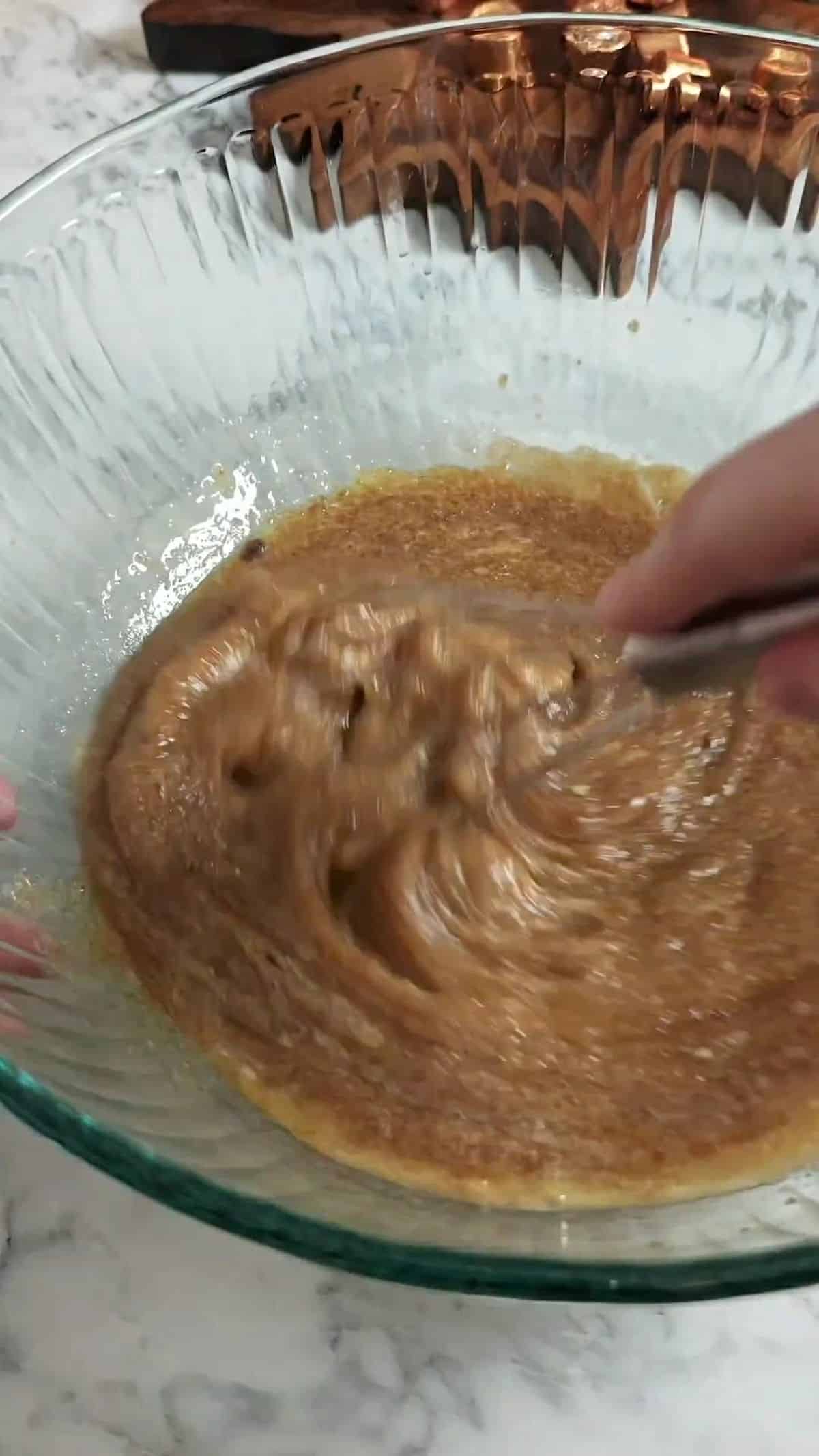 Wet ingredients combined in a large bowl.